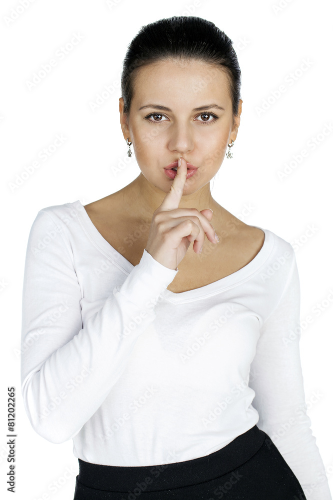 Portrait of attractive teenage girl with finger on lips Portrait of attractive teenage girl with finger on lips