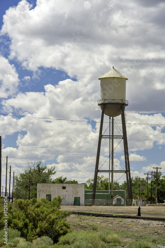 Rusty old water tower and cloudy sky