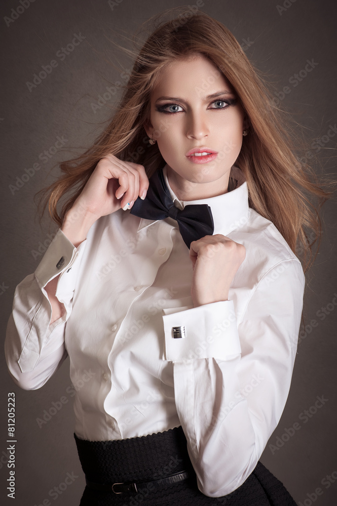 Blondie woman in white shirt and black bow-tie Stock Photo | Adobe Stock