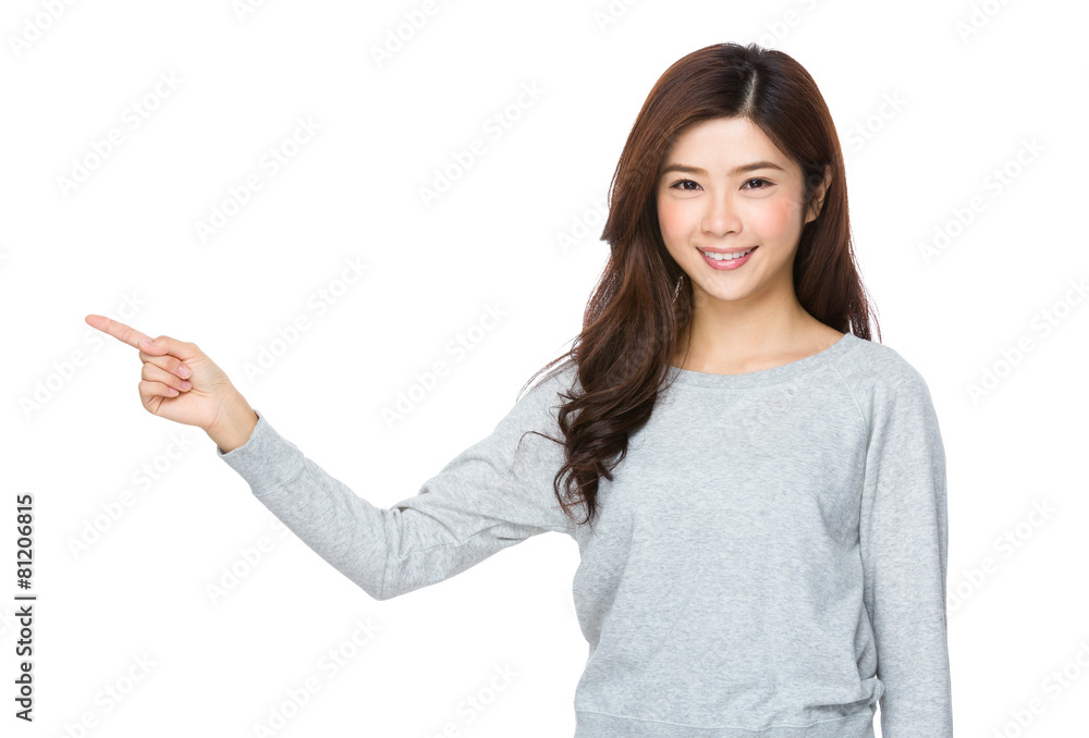 Beautiful young girl pointing copy space Beautiful young girl pointing copy space