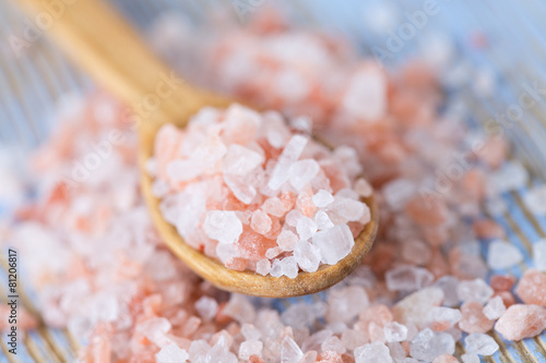 himalayan pink salt on wooden surface photo