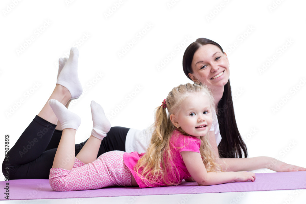 Woman and kid girl exercising together. Healthy life education. Woman and kid girl exercising together. Healthy life education.