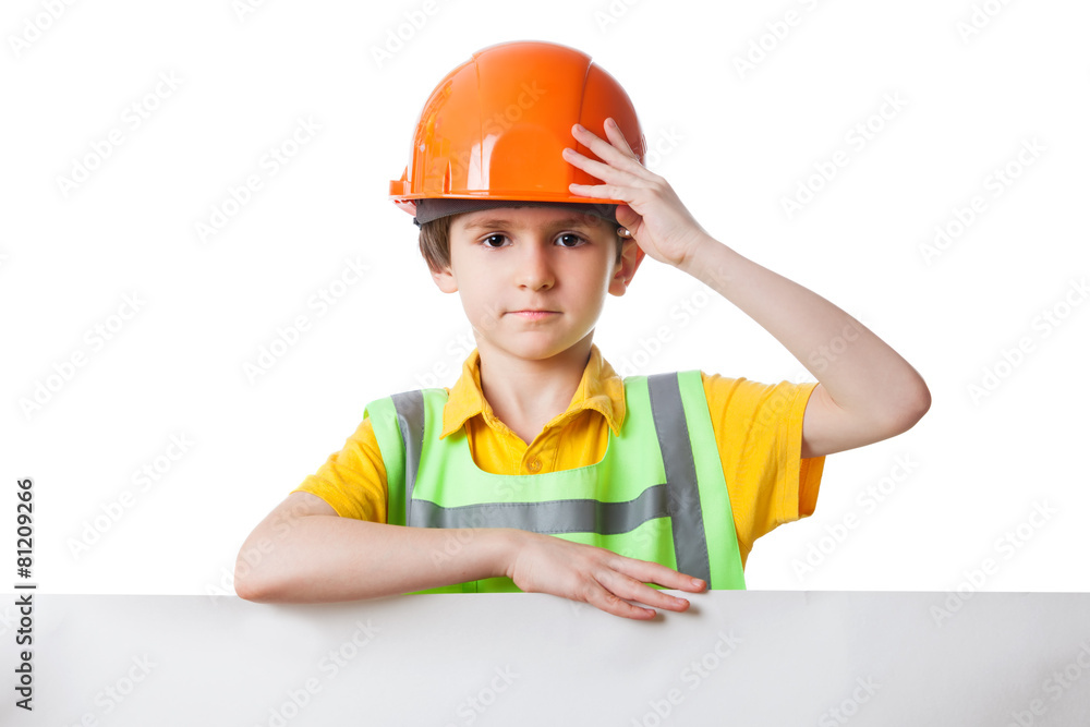 Kid in work clothes stands with billboard, isolated on white Kid in work clothes stands with billboard, isolated on white