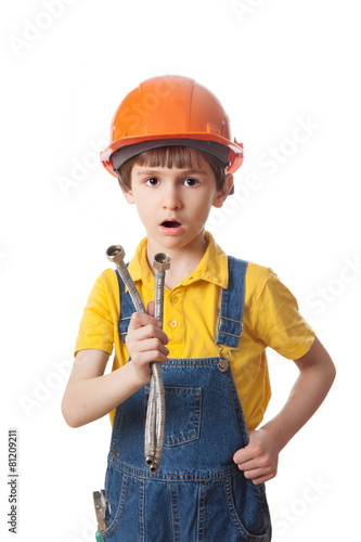 surprised boy in a protective helmet holding a flexible liner