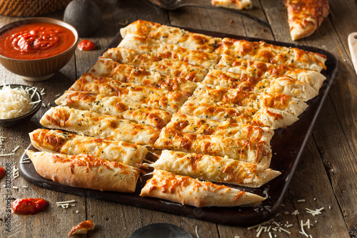 Fotografie Homemade Cheesy Breadsticks with Marinara