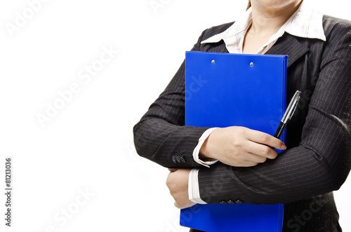 a business woman hugging note pad and holding a pen