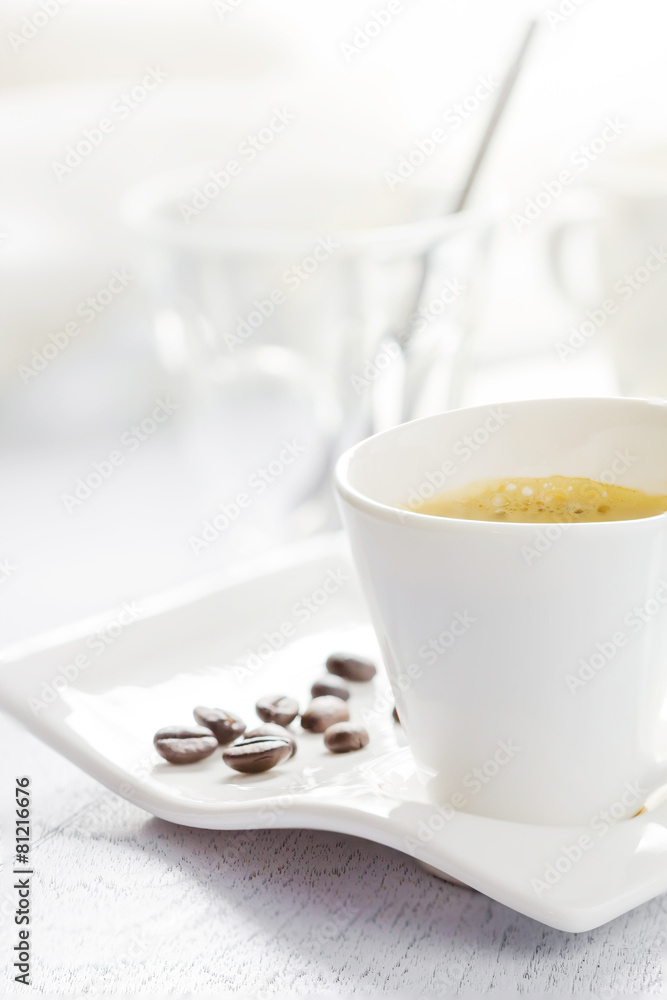 Cup of coffee on white wooden background Cup of coffee on white wooden background