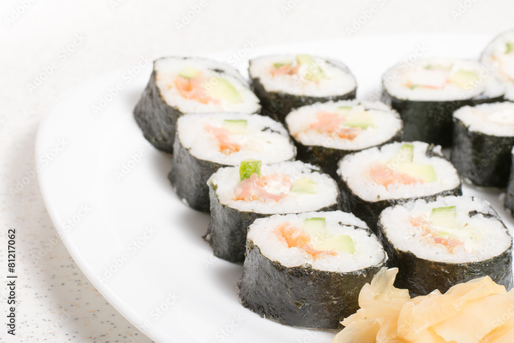 Homemade sushi in a white plate with wasabi and ginger Homemade sushi in a white plate with wasabi and ginger