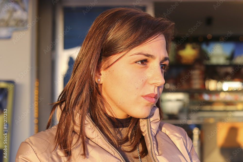 Thinking young (25-30) Sicilian girl near the beach at sunset.  