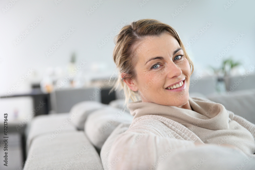 Portrait of mature woman relaxing in sofa Portrait of mature woman relaxing in sofa