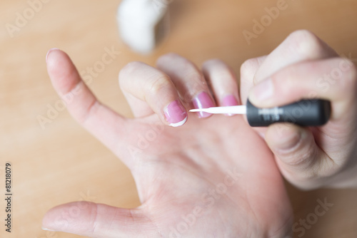 woman in a nail salon receiving a manicure