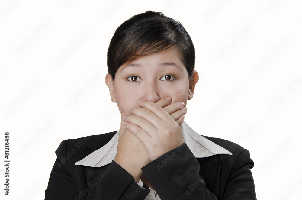 a businesswoman closed her mouth with her hands a businesswoman closed her mouth with her hands