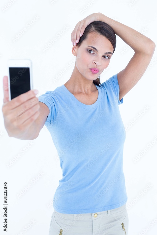 Naklejka premium Beautiful brunette taking a selfie