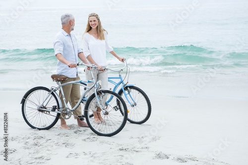Happy couple cycling together