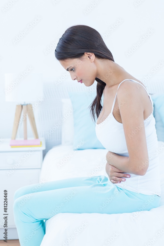 Pretty woman suffering from stomach pain Pretty woman suffering from stomach pain