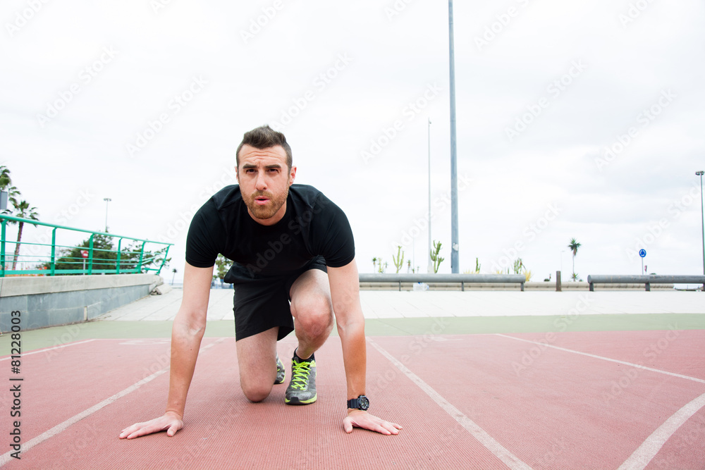 man ready to run on the track