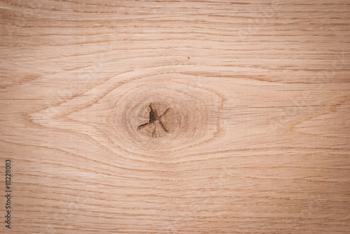 A wooden background with a knag