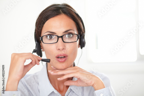 Professional employee speaking on the headphones