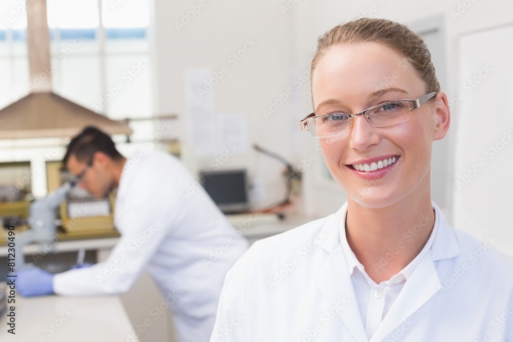 Happy scientist smiling at camera Happy scientist smiling at camera