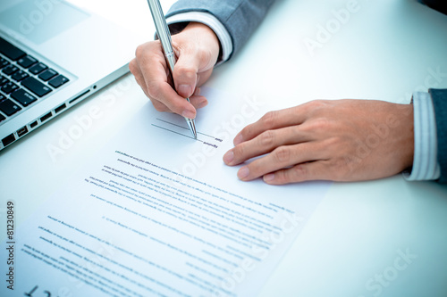 Business man signing a contract