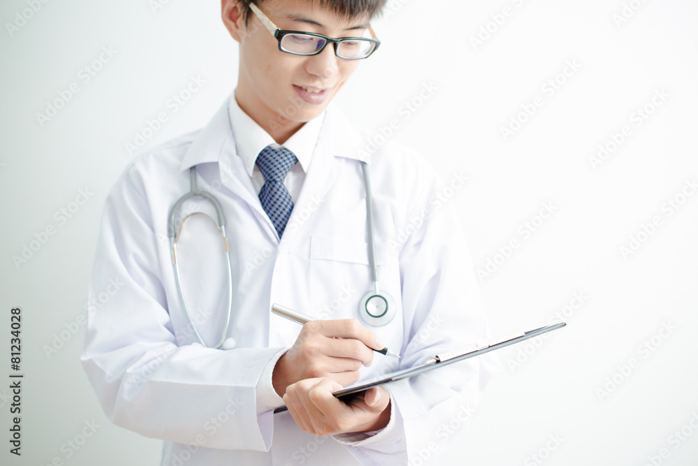 Close-up Of Male Doctor Filling The Medical Form Close-up Of Male Doctor Filling The Medical Form