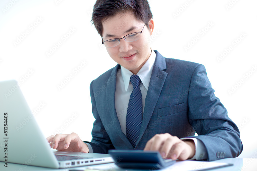 Handsome businessman working with laptop Handsome businessman working with laptop