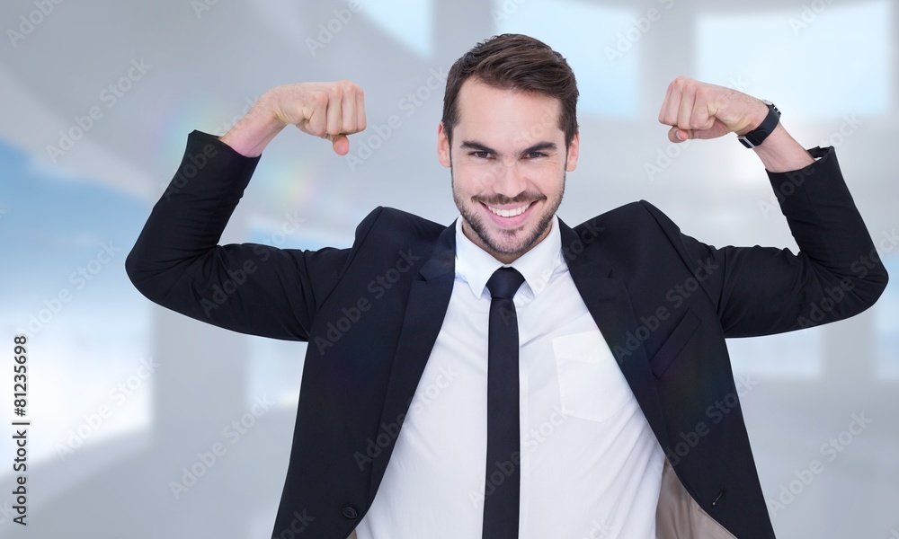 Composite image of happy businessman in suit cheering Composite image of happy businessman in suit cheering