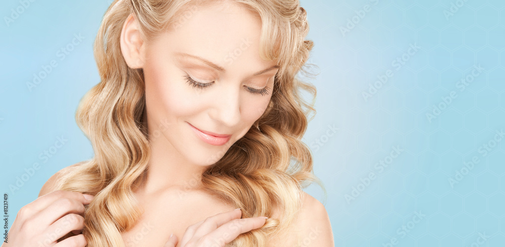 Fototapeta premium beautiful young woman face with long wavy hair