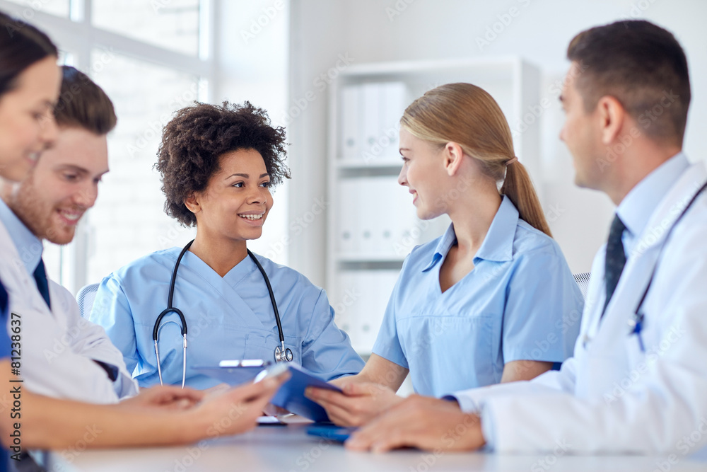 group of happy doctors meeting at hospital office group of happy doctors meeting at hospital office