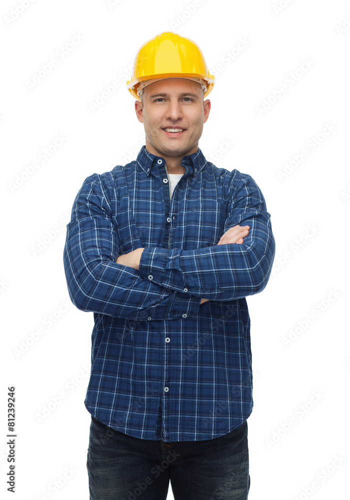 smiling male builder or manual worker in helmet smiling male builder or manual worker in helmet