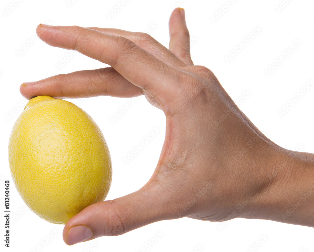 Female hand holding lemon fruit over white background Female hand holding lemon fruit over white background