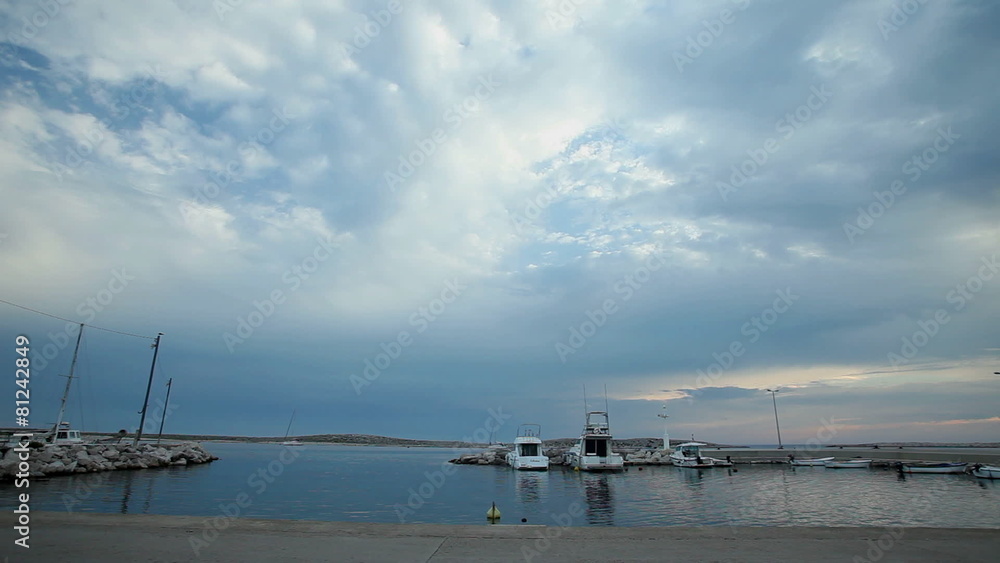 Clouds passing over harbour on Croatian island. Clouds passing over harbour on Croatian island.