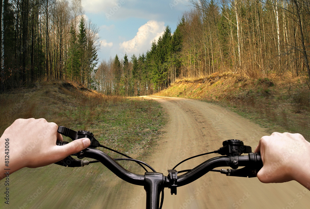 Bike riding on a dirt road. First person view. Bike riding on a dirt road. First person view.