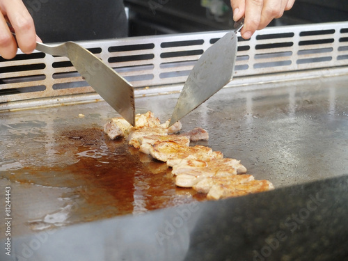 Chef Preparing and Cooking Traditional Pork teppanyaki