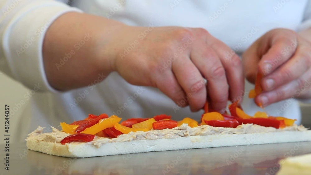 hands prepare a sandwich with peppers hands prepare a sandwich with peppers