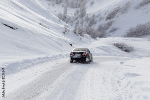 road with a car in winter in the mountains © schankz