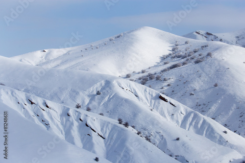 snowy slopes of the Tien Shan Mountains © schankz