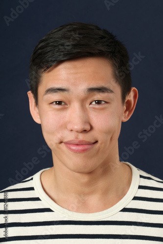 Smiling young Asian man looking at camera © Vladimir Wrangel