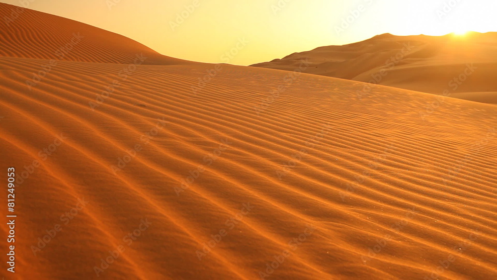 loop sunset in dunes with sand blowing