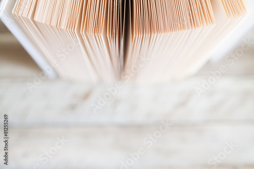 Book pages and wooden desk, empty place on bottom