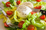 Fresh salad with mozarella cheese and cherry tomatoes, closeup
