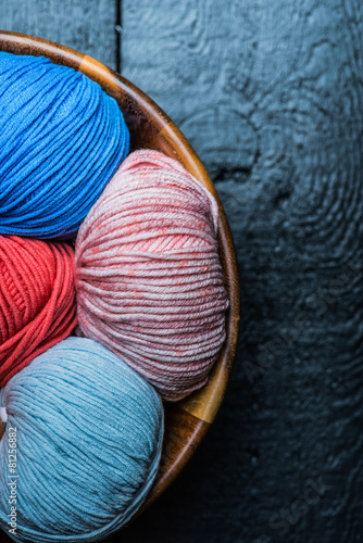 Colorful knitting yarn balls in basket