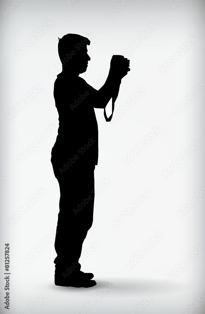 Silhouette of man holding camera isolated on a white background