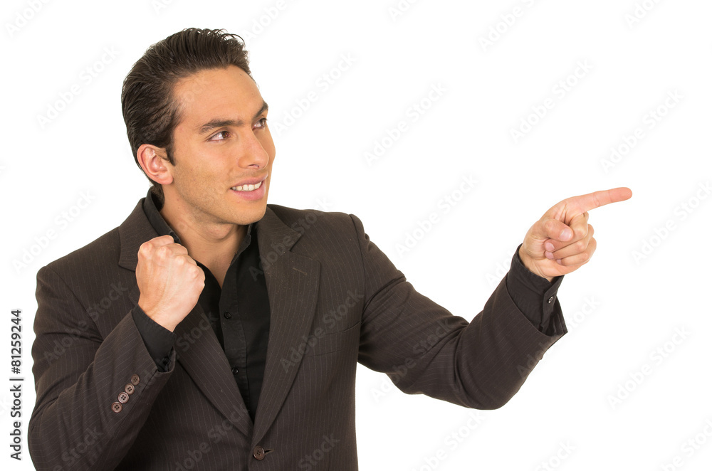 handsome young man wearing a suit posing pointing to the side handsome young man wearing a suit posing pointing to the side
