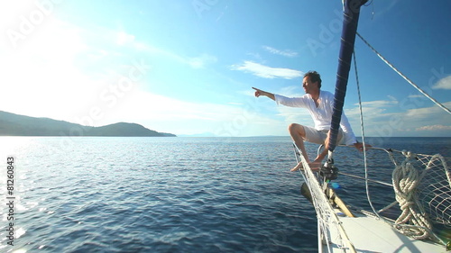 Man enjoying sailing trip on boat