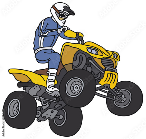 Rider on the yellow all terrain vehicle