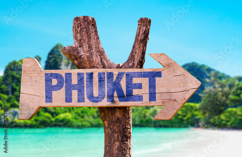 Phuket wooden sign with beach background
