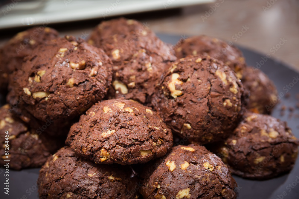 Chocolate and nut cookies on wooden table Chocolate and nut cookies on wooden table