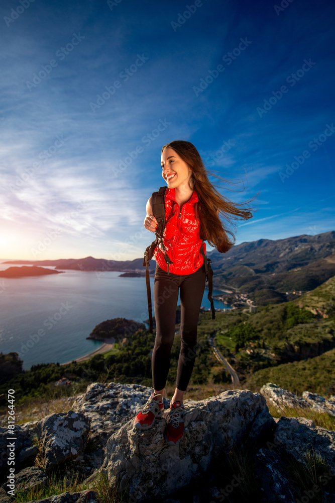 Sports woman on the top of mountain
