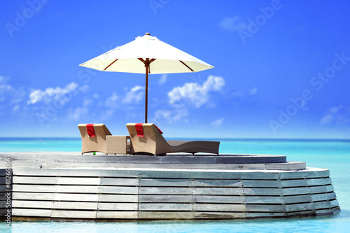 Fototapet View of place for rest with sunbed and parasol in Baros